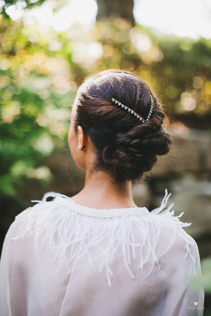 Bridal portrait closeup of updo hairstyle with jewels