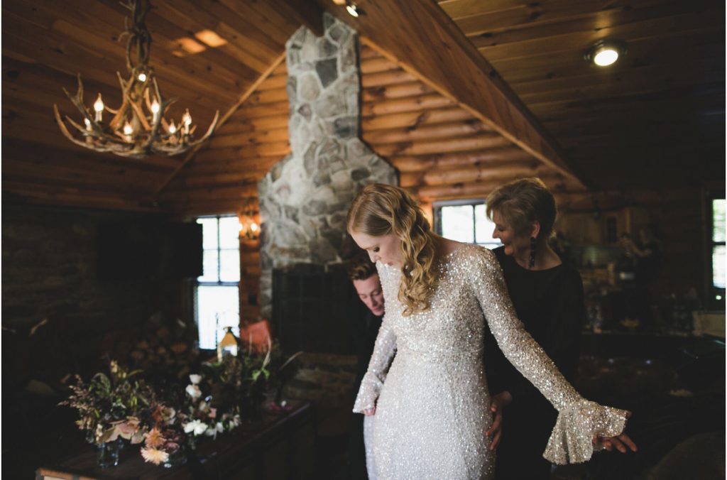 Bride with blonde waves, white sequined dress, cabininterior
