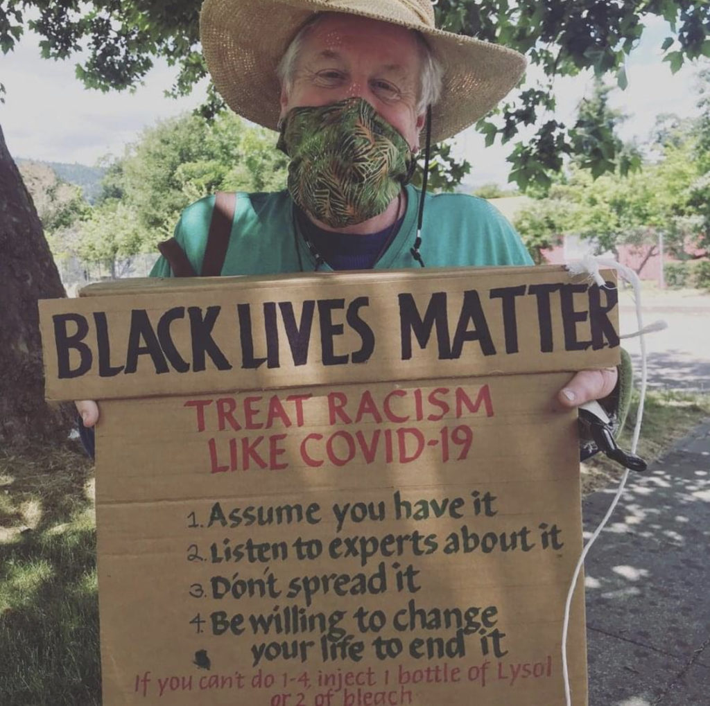 Black Lives Matter protester with home made sign