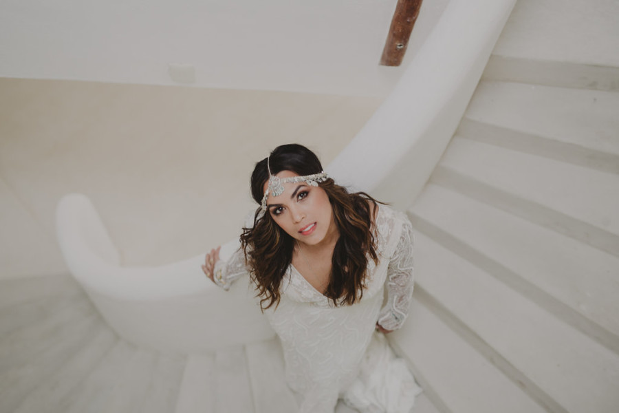 Boho bride with long beach hair, headband, and copper smokey makeup at her wedding in Tulum, Mexico