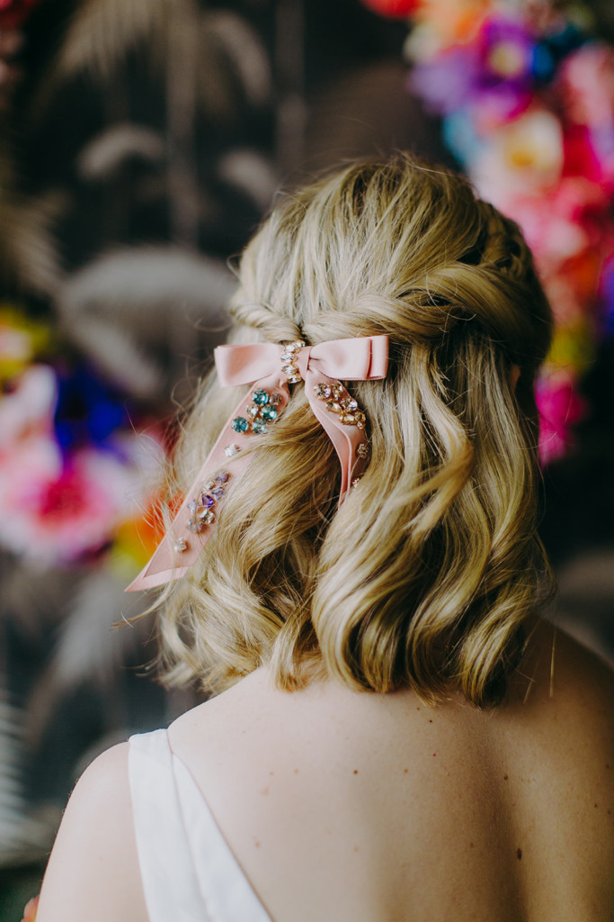 Bride with softly waved blonde hair and custom jeweled hair down on her wedding day in Brooklyn
