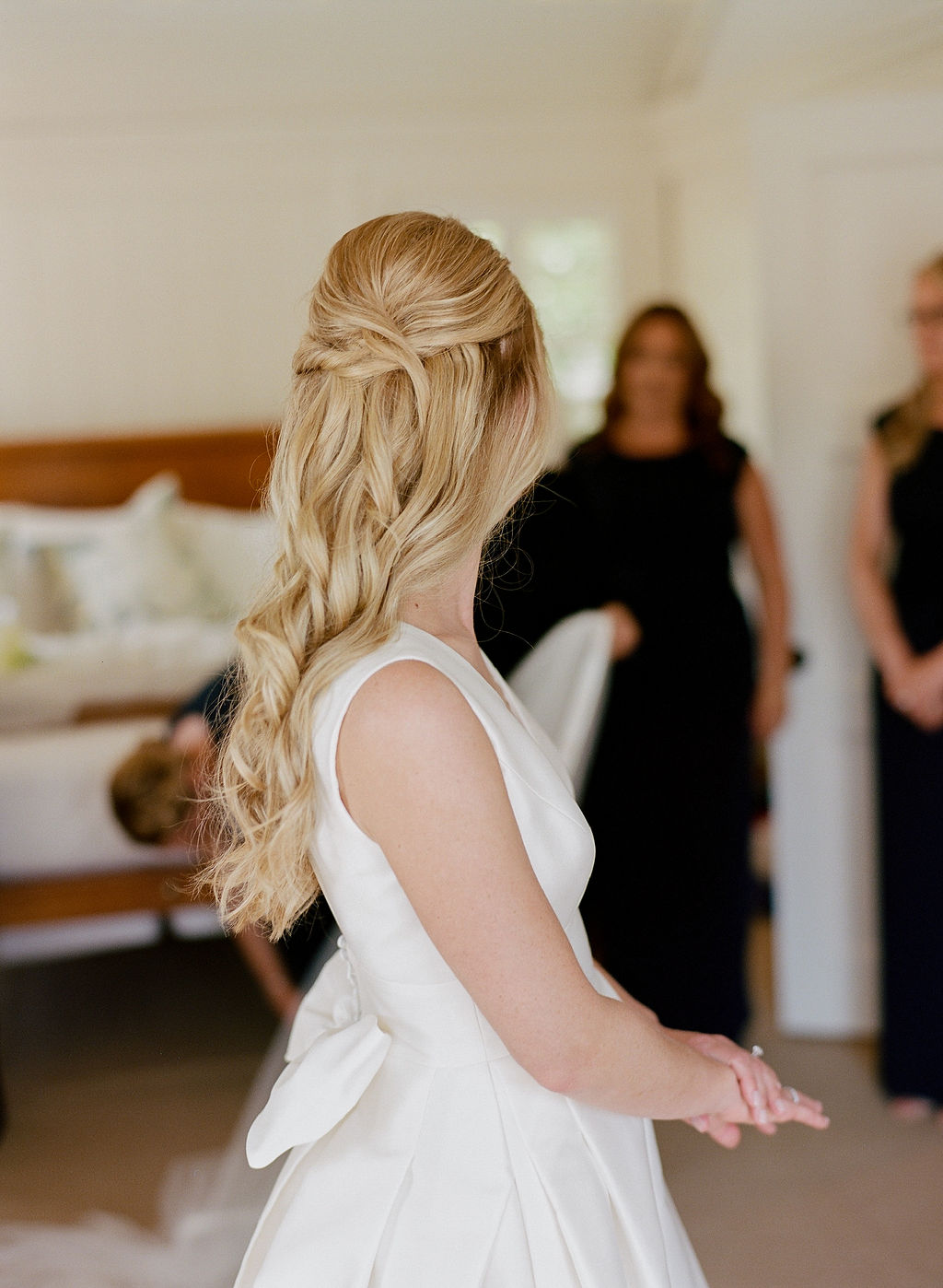 Blonde bride with very long hair and highlights with hair pulled half back off of her face, pictured at the Harborview Hotel in Edgartown, Martha's Vineyard, MA